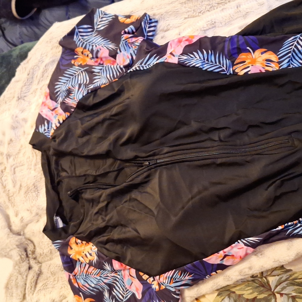 One piece with zip top and boy short style bottom half